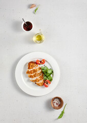 Grilled chicken fillet with cheese, top view with copy space, showcasing a simple yet delicious meal for recipe sites and culinary tutorials