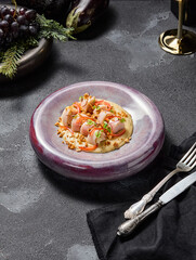 Stuffed squid with cheese sauce and nuts, aesthetically pleasing winter menu