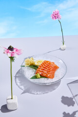 Salmon sashimi over ice with a surreal flower arrangement, capturing the essence of spring and...