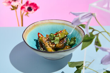 Spicy smashed cucumber salad in Asian style; a fresh and creative culinary presentation with a...