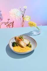 Halibut steak with pumpkin puree and broccoli, ideal for a vibrant summer menu in a high-end eatery