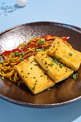 Egg Noodles with Crispy Tofu in a Pastel Spring Inspired Presentation, Suitable for Summer Dining
