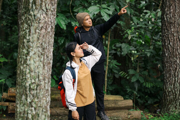 Hiker Couple Have Fun Together On A Hike In Mountain Forest