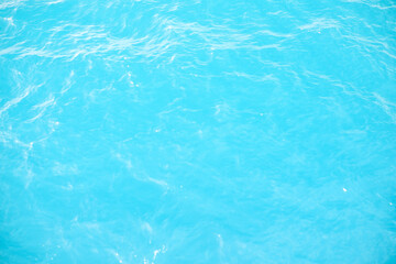 Beautiful texture of calm sea waves in the middle of the sea during the day. view from the boat of calm sea waves