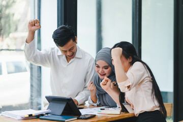 Cheerful and diverse business colleagues celebrating success.