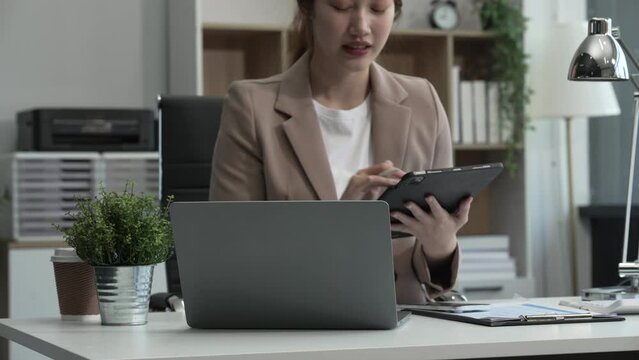 young Asian businesswoman, dressed in a formal suit, navigates complexities of the stock market as a consultant, loan officer, financial advisor, embodying entrepreneurship and strategic prowess.