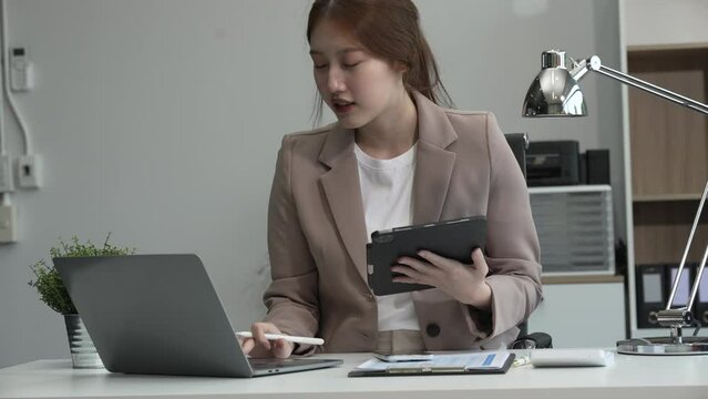 young Asian businesswoman, dressed in a formal suit, navigates complexities of the stock market as a consultant, loan officer, financial advisor, embodying entrepreneurship and strategic prowess.