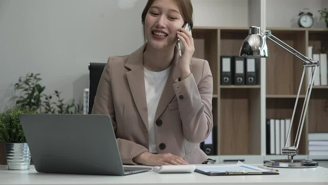 young Asian businesswoman, dressed in a formal suit, navigates complexities of the stock market as a consultant, loan officer, financial advisor, embodying entrepreneurship and strategic prowess.