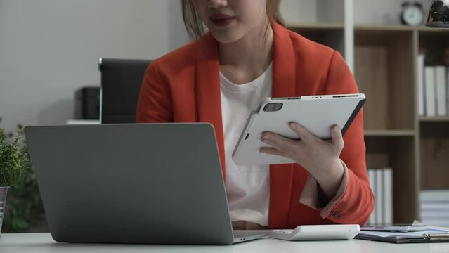 young Asian businesswoman, dressed in a formal suit, navigates complexities of the stock market as a consultant, loan officer, financial advisor, embodying entrepreneurship and strategic prowess.