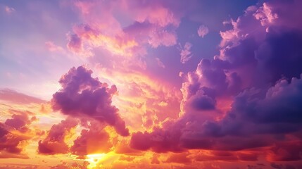 A beautiful sunset with a sky full of vibrant clouds, painted in shades of orange, pink, and purple by the setting sun