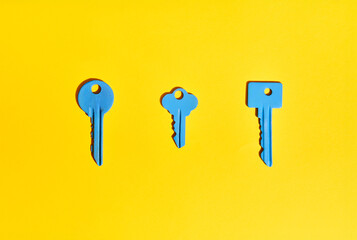 Blue keys on vibrant yellow background