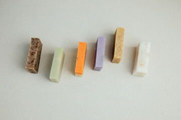 Handmade soap from natural ingredients, various herbs. Concept of sustainable use, bath products. Top view