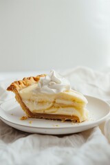 A slice of banana cream pie with a dollop of whipp cake, dessert, food, sweet, pie, plate, chocolate, delicious, slice, cream, pastry, fruit, white, apple, snack, piece, closeup, bread, gourmet, chees