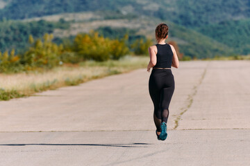 Unstoppable: A Determined Athlete Trains Through the Rain in Pursuit of Marathon Glory