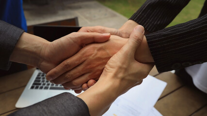Businessman hand as lending a helping hand as trust together with compassion concept as lens flare...
