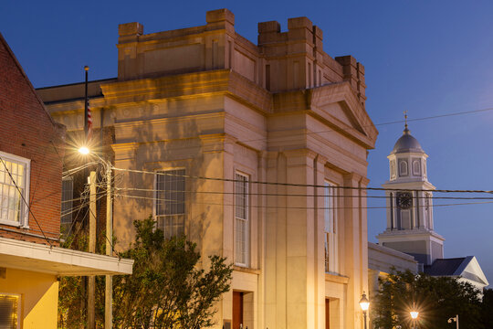 Natchez, Mississippi, USA - April 21, 2024: Twilight light descends on a quiet downtown Natchez landscape.