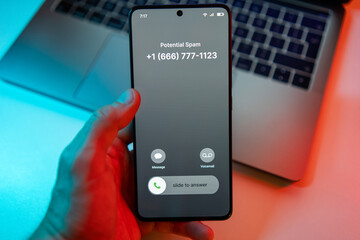 Spammer call on phone. Spam incoming call on cell phone. Spam and junk concept