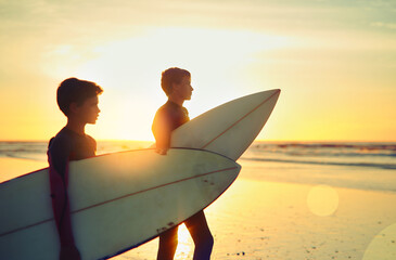 Sunset, beach and kids with board to surf on adventure in summer vacation and holiday. Children,...