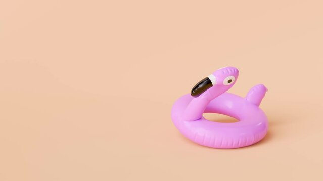 Pink Flamingo Float Inflating on Peach Background with Copy Space