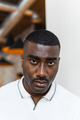 Serious young african american man portrait in coffee shop