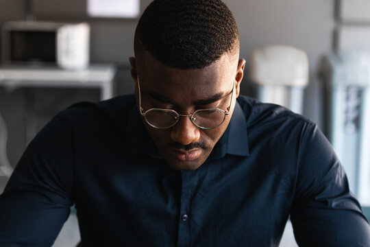 Portrait Of A Serious Young Black Man Looking Down