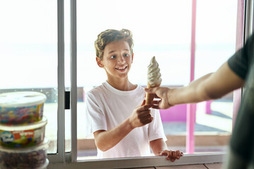 Shop, window or excited boy child with ice cream surprise outdoor for snack, request or payment on...