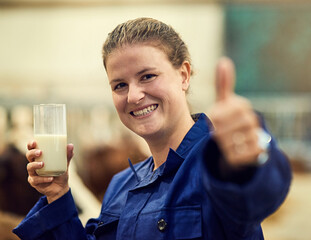 Woman, farmer and thumbs up on farm with hand gesture, approved and cow milk in glass for organic...