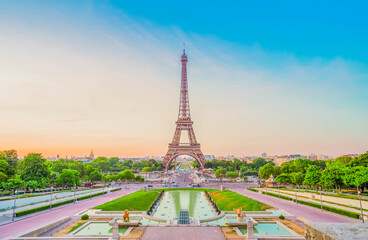 Paris Eiffel Tower and Trocadero garden at sunset in Paris, France. Eiffel Tower is one of the most...
