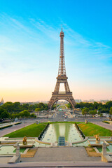 Paris Eiffel Tower and Trocadero garden at sunset in Paris, France. Eiffel Tower is one of the most famous landmarks of Paris.