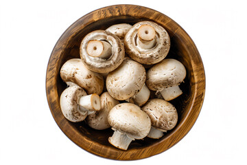 a wooden bowl filled with mushrooms on top of a white surface