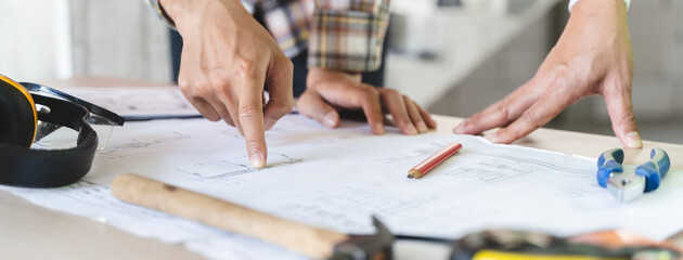 Close up hands of businessman from consultancy service discussing with project contractor and...