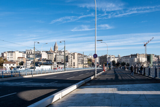 Cityscape from the Galata Bridge, spanning the Golden Horn, an arm of the sea, with the New Mosque (Yeni Cami), an Ottoman imperial mosque and landmark in the background, Istanbul, Turkey