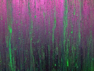 Purple green neon background. Abstract splatter on leak vintage wall. Paint splatter, green leak on...