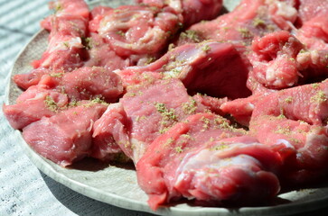 sliced ​​veal, with spices, close up view of fresh meat