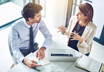 Business people, partnership and strategy for finance with laptop in office from above with data...