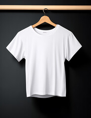 White t-shirt hanging on a wooden clothes hanger on a black background