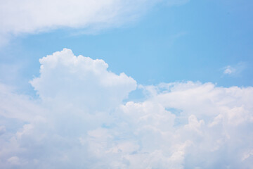 Blue sky background with colorful small clouds