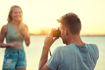 Camera, couple or woman in picture at sunset for outdoors nature sharing experience on date by...