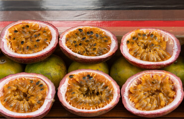 Passion fruit fruit in a section as a background.