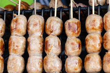 round fried sausages as a background.