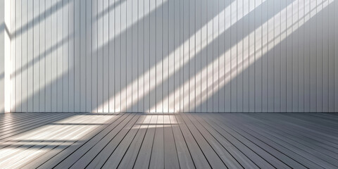 Minimalist interior with sunlight streaming through windows creating long shadows on a wooden floor and white paneled walls emphasizing simplicity and elegance
