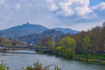 Fototapeta premium Bridge over the river Po with a view of the pilgrimage church of Superga in Turin