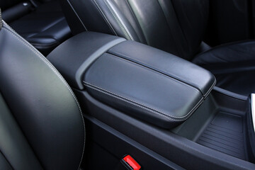 Luxury SUV leather armrest. Armrest and Cups Holder - Modern Vehicle Interior. Luxury car interior...