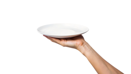 A hand carefully holds a clean white plate while another hand supports a matching empty bowl below