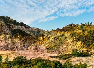 landscape of Plegrean volcano fields in Naples Italy near Pompeii with sulfur yellow caldera duribg eruption of smoke. campi Flegrei and cataclysm of Earthquake