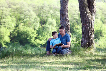 father and child reading the bible