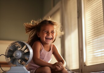 Girl in front of fan on hot summer day