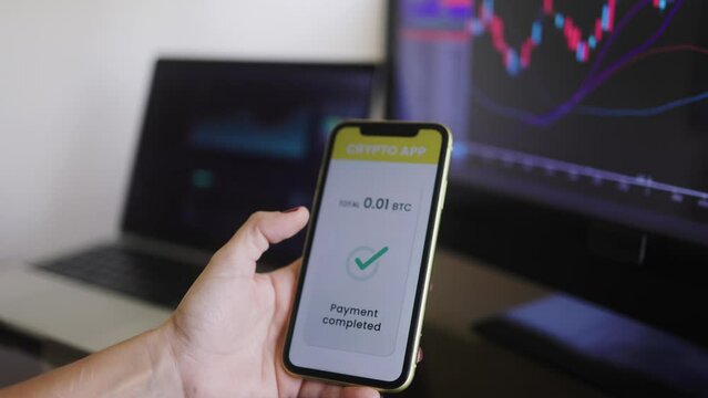 Business trader using crypto payment service app with mobile phone for Bitcoin purchase. Cryptocurrency trend technology concept