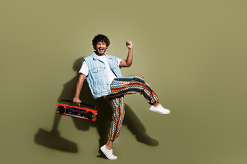Full body photo of attractive young man dance winning boombox dressed stylish denim clothes...
