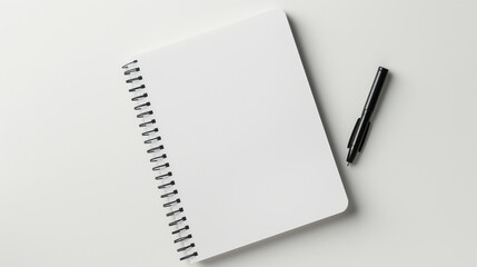 A minimalist notepad placed on a plain white background, creating a clean area for text around it